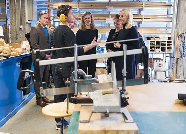 Crown Princess Mette-Marit of Norway visited the Oslo School of Architecture and Design. Princess Prada boots and Stella McCartney wool coat