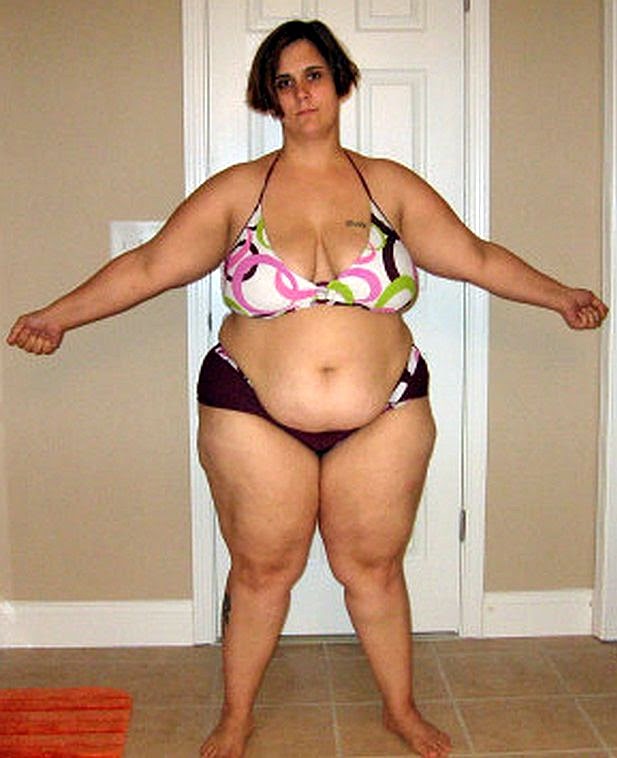 chubby sluts in bikini - Fat girl wearing a black print swimsuit showing her huge fat belly