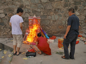 paper house burning for the Hungry Ghost Festival