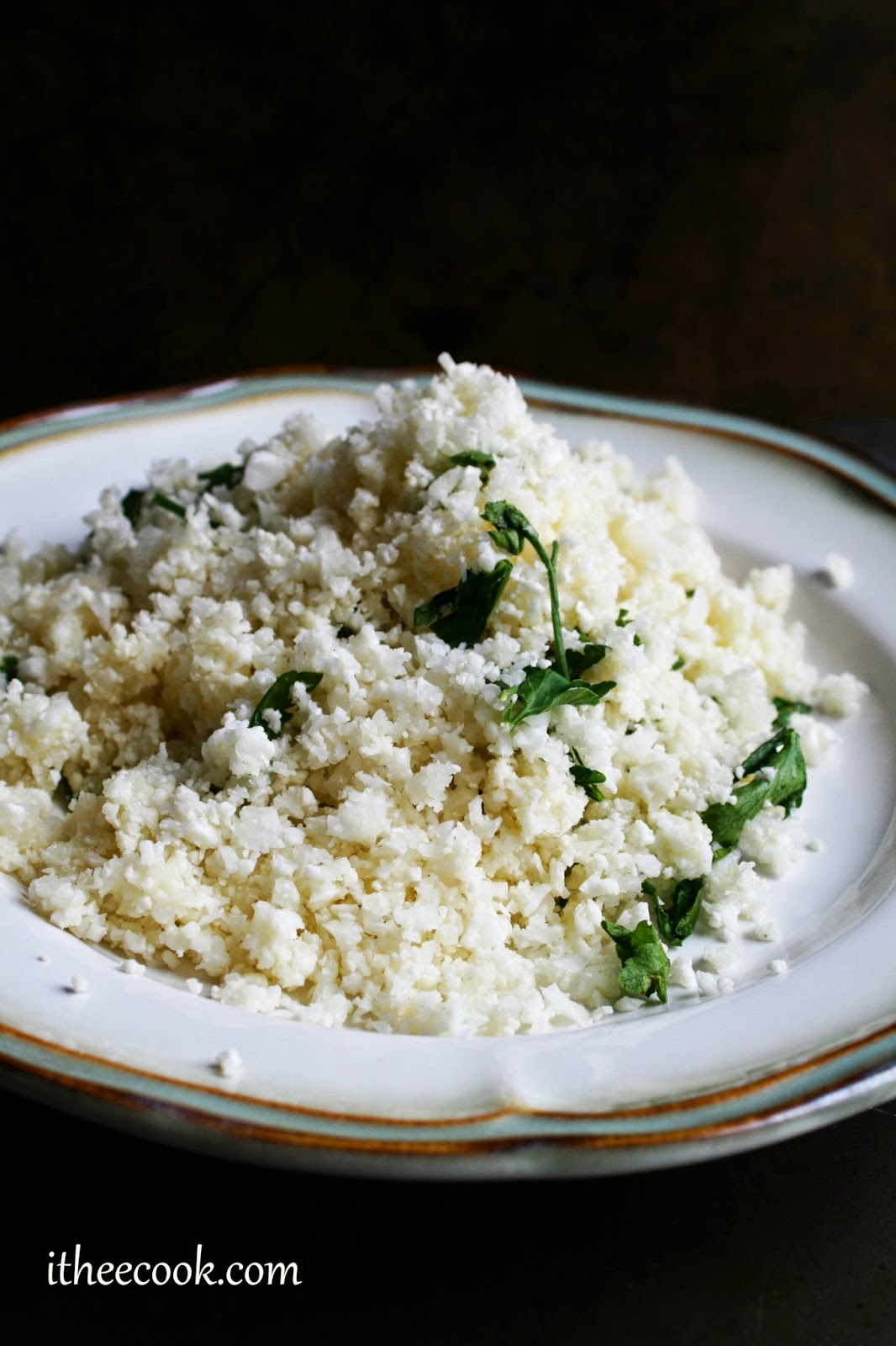 Herbed Cauliflower Rice, sauteed with fresh herbs and topped with parmesan and butter, a easy, delicious side dish!