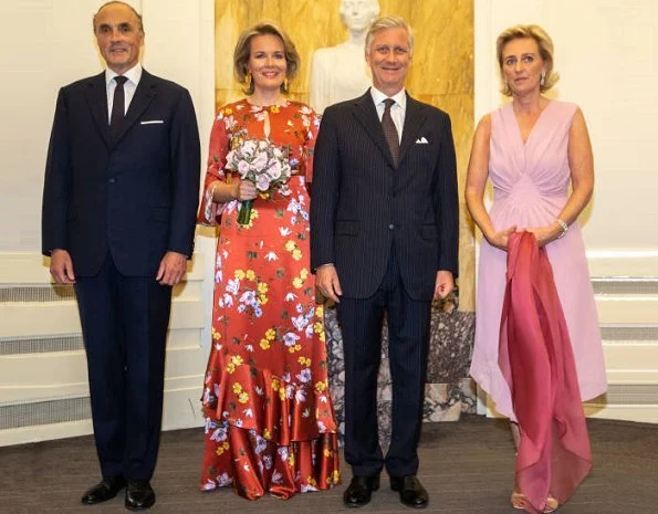 Queen Mathilde wore Diane von Furstenberg Floral-printed silk jumpsuit. Princess Astrid and Prince Lorenz at National Day and Bal National festivities