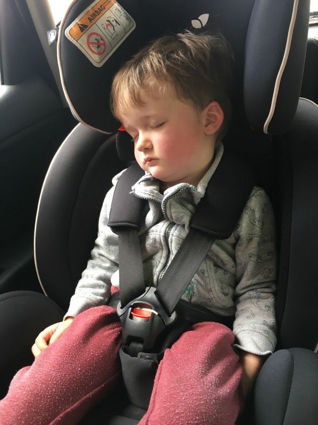 boy-asleep-in-car-seat