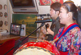 traditional music, sanshin, drum, man and woman, Mineo band