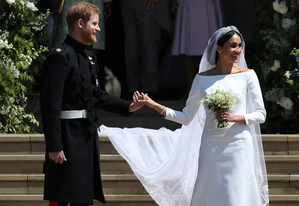 Markle wore a silk organza boat neck long sleeve wedding dress designed by famous British designer Clare Waight Keller.