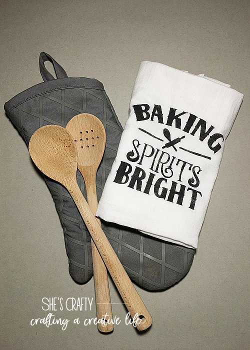 tea towel, oven mitt, wooden spoons