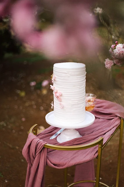 poppy and sage photography weddings cherry blossoms bride groom cake styling
