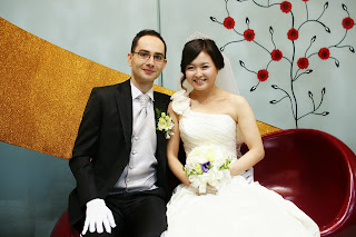 Korean bride and western groom before the wedding ceremony having photos