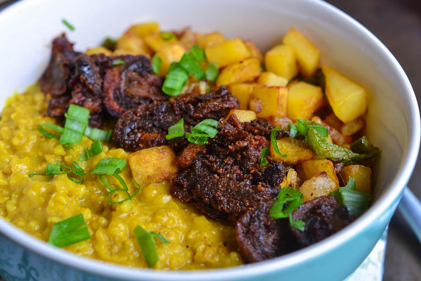 Greedy Girl Savory curry oatmeal bowl with mushroom “bacon” and hash