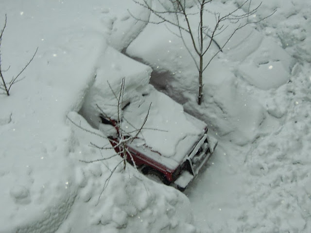 Even once you dig out your car (and make it out of a 5 story building covered in snow), actually getting to a road would be tricky. Even once you dig out your car (and make it out of a 5 story building covered in snow), actually getting to a road would be tricky.