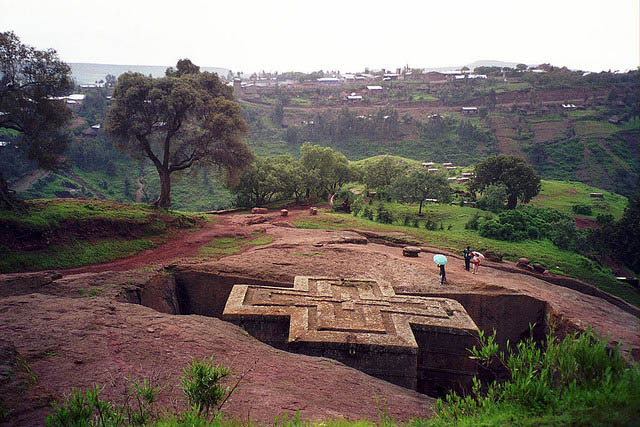 Priest in Bet Danaghel Church holding the Cross of King Lalibela. The  rock-hewn churches of Lalibela make it one of the greatest  Religio-Historical sites not only in Africa but in the Christian