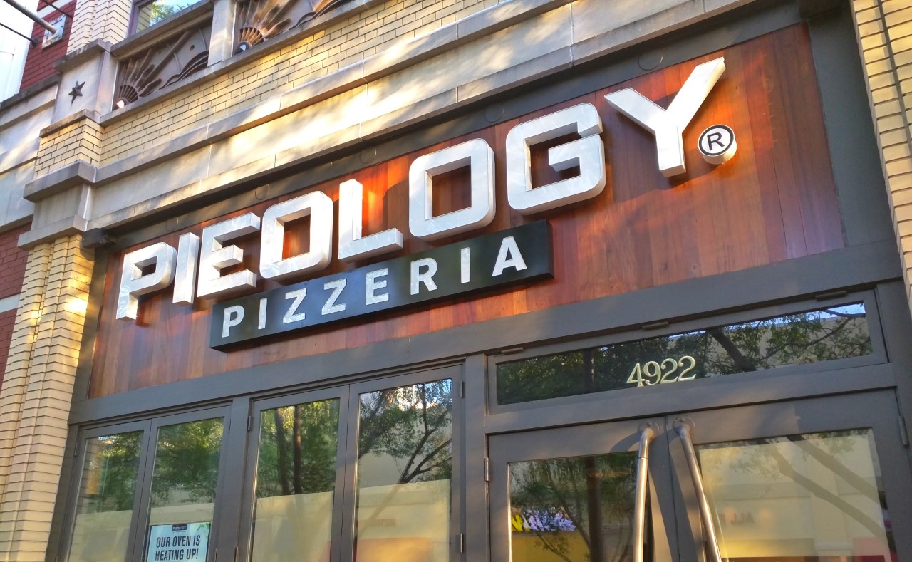 Robert Dyer Bethesda Row Sign installed at Pieology at Bethesda Row