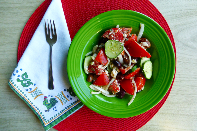 Greek Salad, tomatoes, cucumber, onion, feta chese, kalamata olives, olive oil, fiestaware