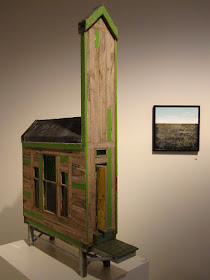 Building and wall piece on display at the Alex Asch exhibition at Beaver Galleries.