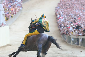 Packed crowds line the narrow circuit for the Palio di Siena