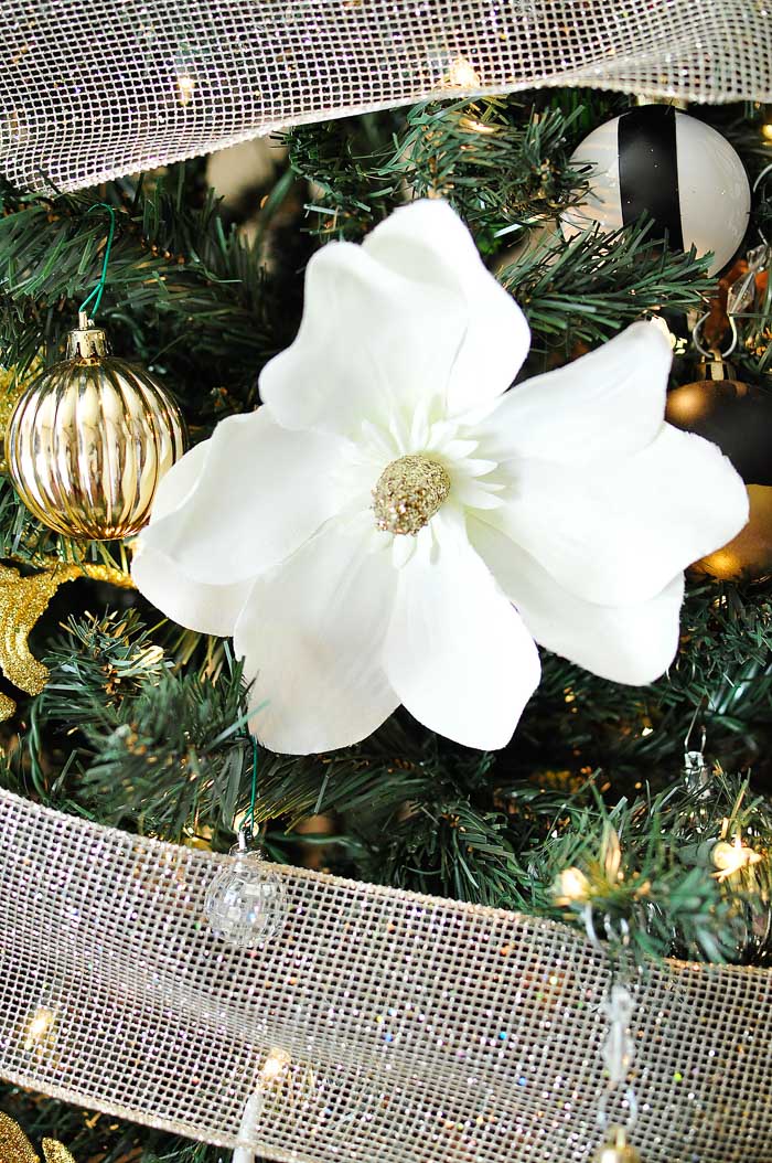 Tips for creating a beautiful, glam and chic black, white, gold and silver Christmas tree for your holiday decor!