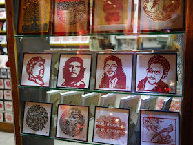 red paper-cut portraits of Mao Zedong, Che Guevara, Michael Jackson, and Edward Snowden
