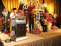 The doa ceremony with the wedding couple up on stage