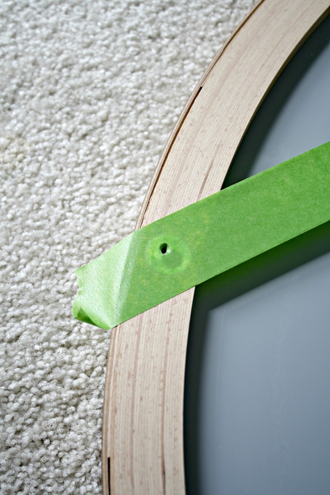 Easy tape trick for hanging art perfectly straight from Thrifty Decor Chick