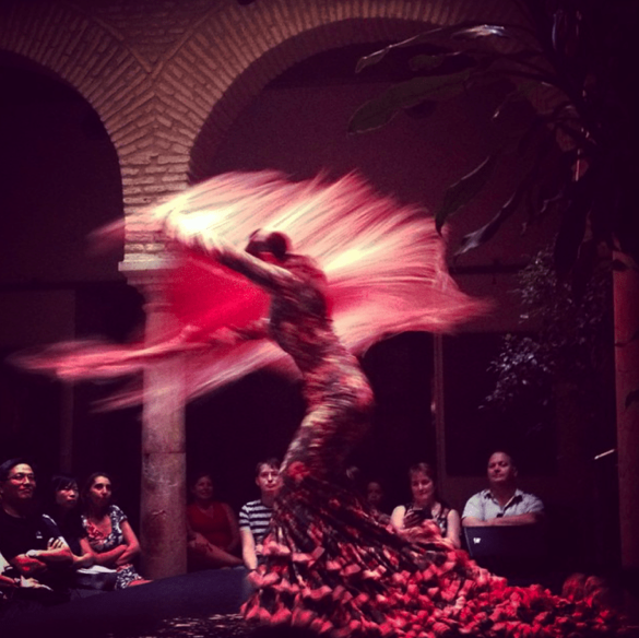 female flamenco dancer spinning around at museo del bale flamenco
