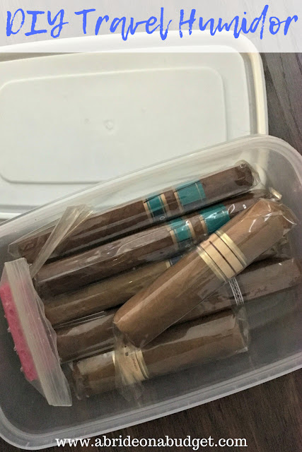 Cigars in a plastic container with the words "DIY Travel Humidor" digitally written on top.