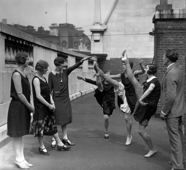 Chorus girls work on their high kicks on the roof of the Gaiety Theatre