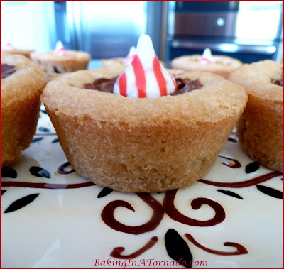 Holiday Chocolate Mint Cookie Cups, an impressive holiday treat made with just 3 store bought ingredients | Recipe developed by www.BakingInATornado.com | #recipe #holiday #dessert