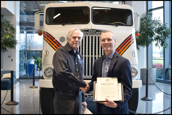 Jeffrey Thompson (r), director of Aftermarket Supply Chain Planning, receives the Employer Support for the Guard & Reserve Patriot Award from Bruce Thompson (l)