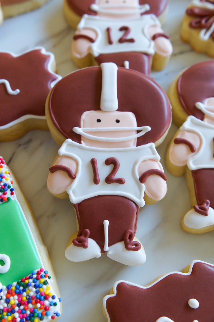 step-by-step tutorial for making football player cookies #aggies | bakeat350.net
