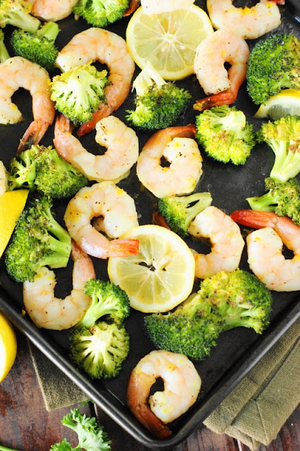 Roasted Shrimp & Broccoli Sheet Pan Supper ~ With just a little tossing of ingredients together, this one-pan dish with tasty lemony shrimp and cumin-spiced roasted broccoli is ready in under 30 minutes.   www.thekitchenismyplayground.com