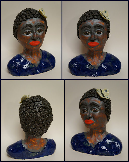Beautiful ceramic pottery sculpture of a negro woman.