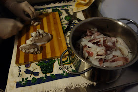 Octopus being chopped up for seafood soup Toscana Italia