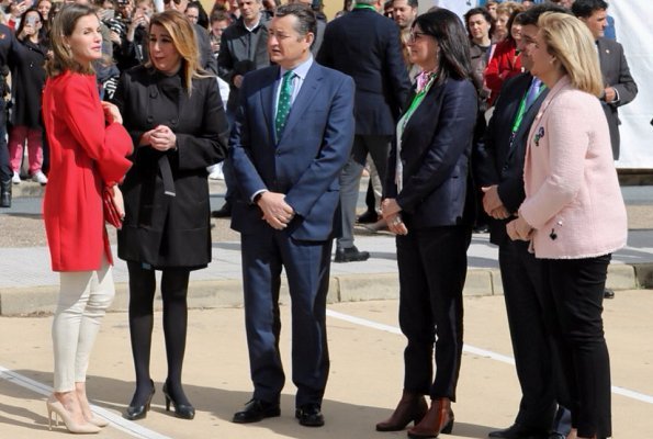 Queen Letizia wore Zara frilled sleeve coat and wore Lodi Saray Pumps, she carried Carolina Herrera red python clutch at AndalucíaSkills event