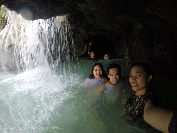 Mini cave behind Cambugahay Falls' water curtain