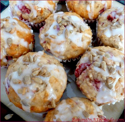 Raspberry Sunflower Seed Oat Muffins, bursting with fresh flavors, a delicious way to start your day. | Recipe developed by www.BakingInATornado.com | #recipe #bake