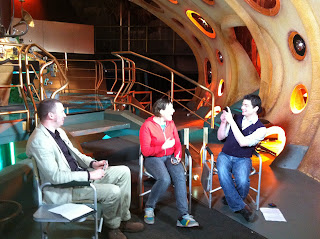 Simon Guerrier, Josie Long and Joseph Lidster in the TARDIS
