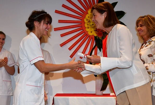 Princess Caroline of Hanover attended graduation ceremony of Nursing Training Institute in Monaco. white satin blouse