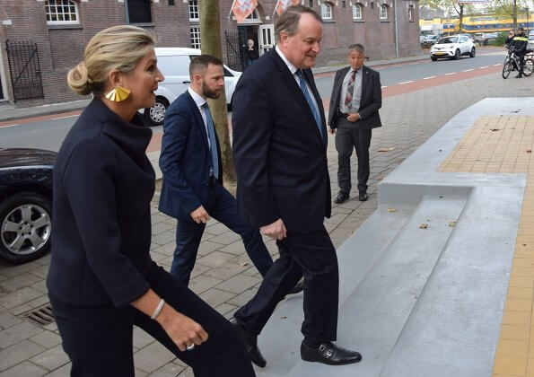 Queen Maxima visited Verkadefabriek in s-Hertogenbosch city. Susanne Friis Bjørner gold earrings and Natan top and pants