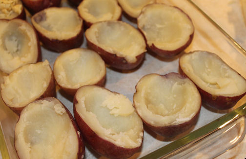You will scoop the center from each of the potatoes and fill with stuffing. Potatoes Ready for Filling