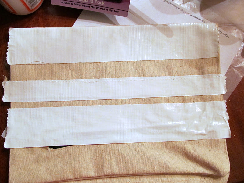 SMALL CANVAS CLUTCH MASKING MADNESS main image 1