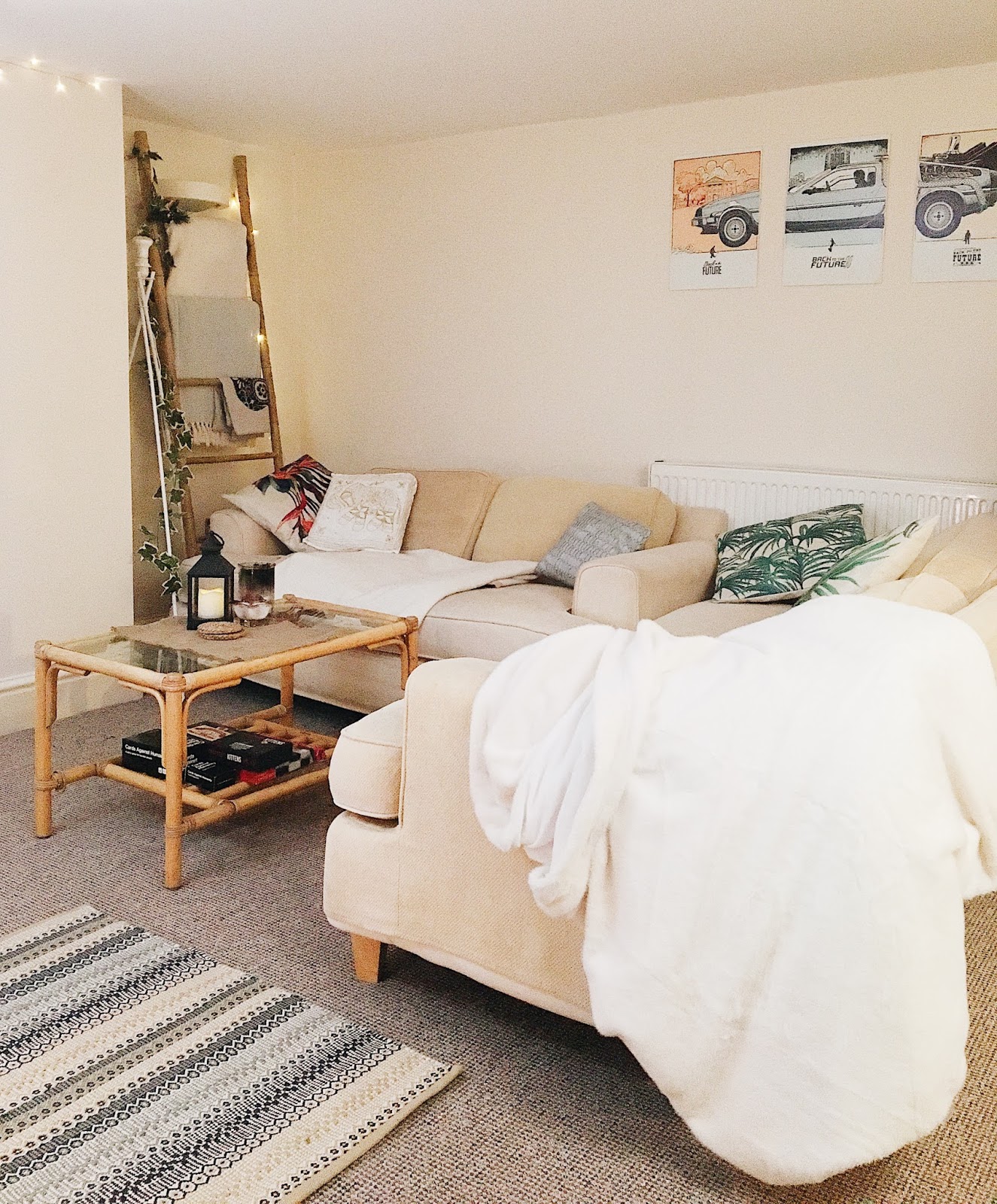 living room with blanket ladder and fairy lights