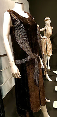 1920s brown velvet evening dress, with beading designed to resemble a knotted sash