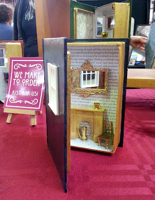 Miniature room in a book box on a market stall.