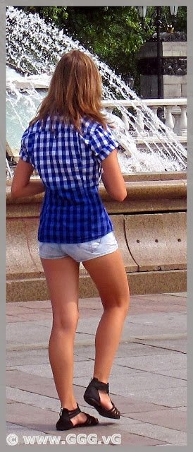 Girl on the street wearing denim mini shorts  