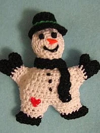 http://www.ravelry.com/patterns/library/snowman-pin-2