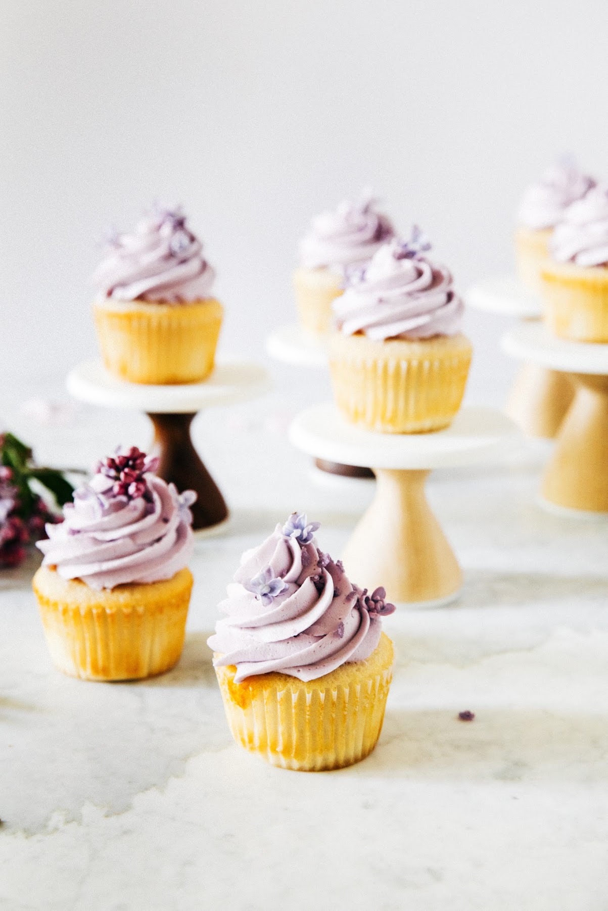ginger almond cupcakes with lilac buttercream frosting