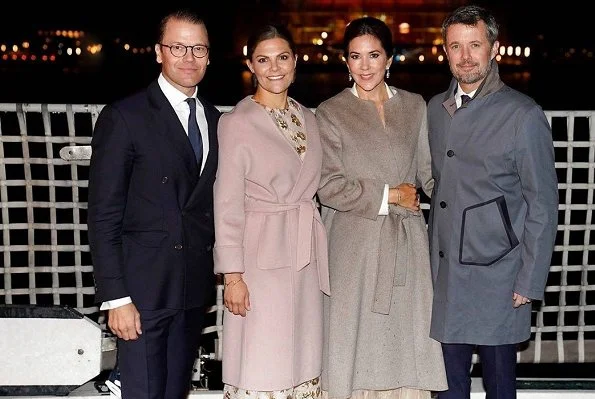 Crown Princess Victoria wore MaxMara pink Lilia cashmere wrap coat. Crown Princess Mary wore a Ralph Lauren dress