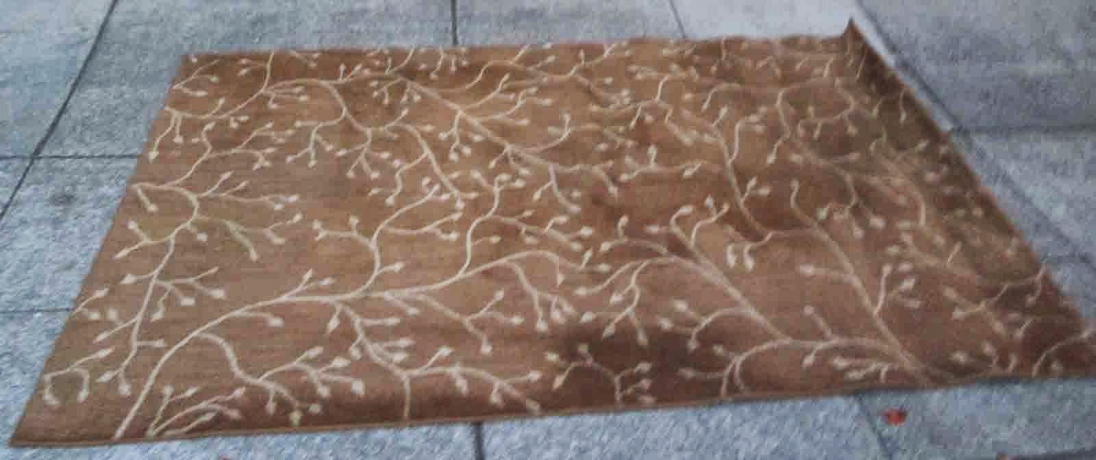 UHURU FURNITURE & COLLECTIBLES SOLD Copper Color Rug with Leaves 60