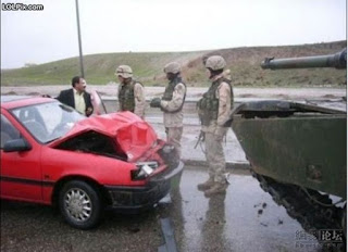 photo of a guy who crashed into the back of a tank
