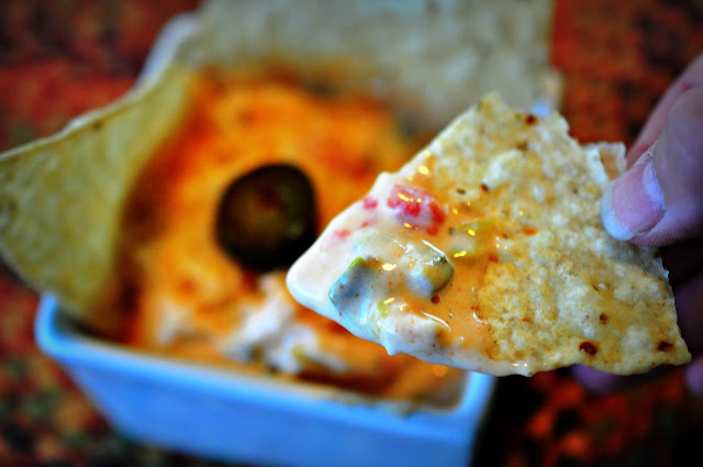 If you love chicken but don't like the mess of BBQ sauce and wing stuff on your fingers, try popping some shredded chicken into your favorite queso dip like I did to create Crockpot Spicy Chicken Dip for your next tailgate or sports party gathering.
