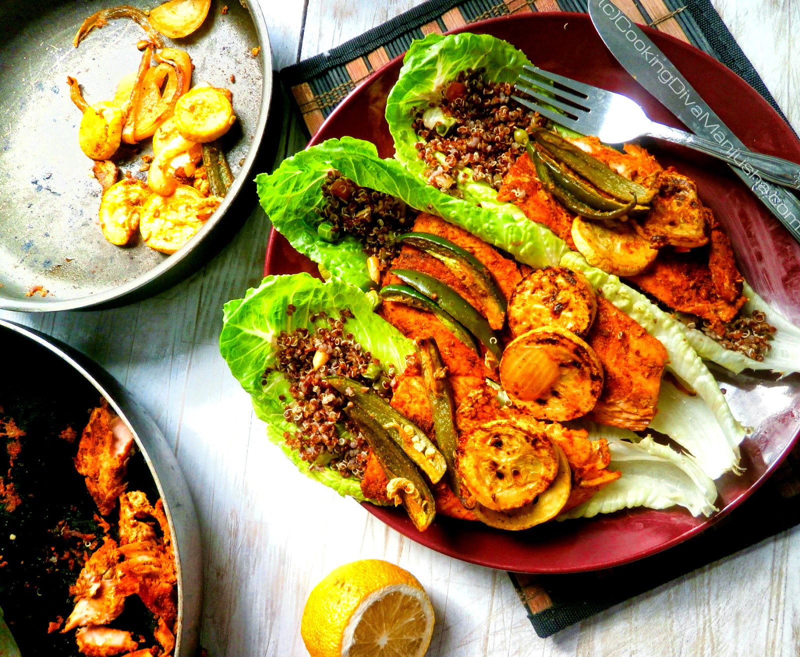 Quinoa salad on a bed of lettuce,pan fried salmon,jalapenos & squash